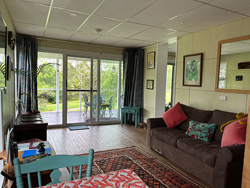 Living room with extra sleeping space at Bessie's Country Escape